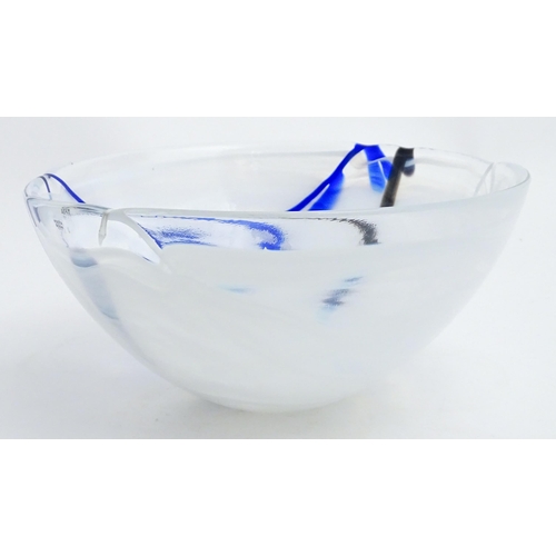 320 - A large Kosta Boda art glass bowl with blue and black detail. Approx. 6 1/2