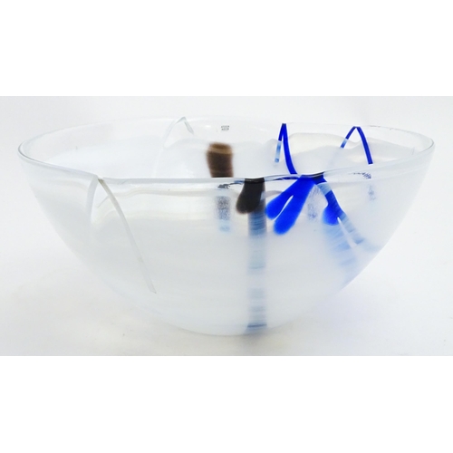 320 - A large Kosta Boda art glass bowl with blue and black detail. Approx. 6 1/2