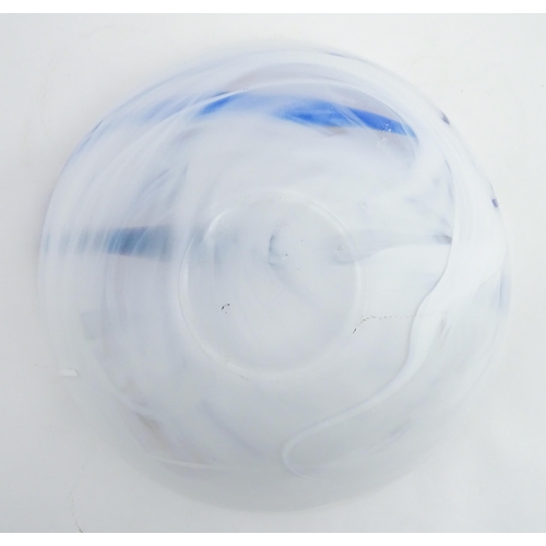 320 - A large Kosta Boda art glass bowl with blue and black detail. Approx. 6 1/2