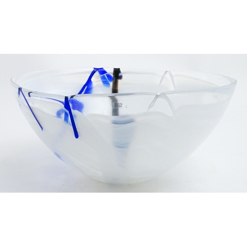320 - A large Kosta Boda art glass bowl with blue and black detail. Approx. 6 1/2