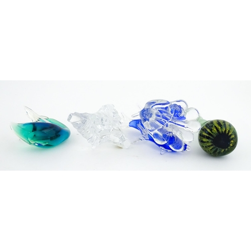 322 - Four assorted glass paperweights / models  to include a Mdina glass seahorse paperweight, unsigned, ... 