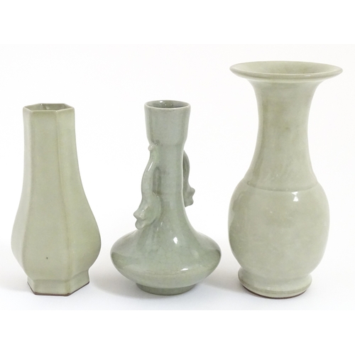30 - Three Chinese celadon vases to include a one with a flared rim, one with twin handles of stylised fi... 