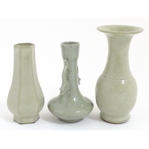 30 - Three Chinese celadon vases to include a one with a flared rim, one with twin handles of stylised fi... 