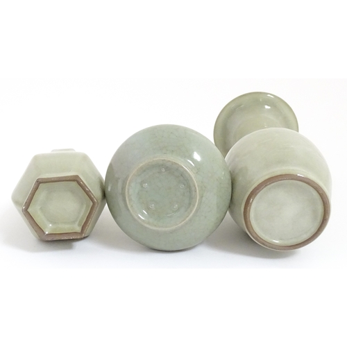 30 - Three Chinese celadon vases to include a one with a flared rim, one with twin handles of stylised fi... 