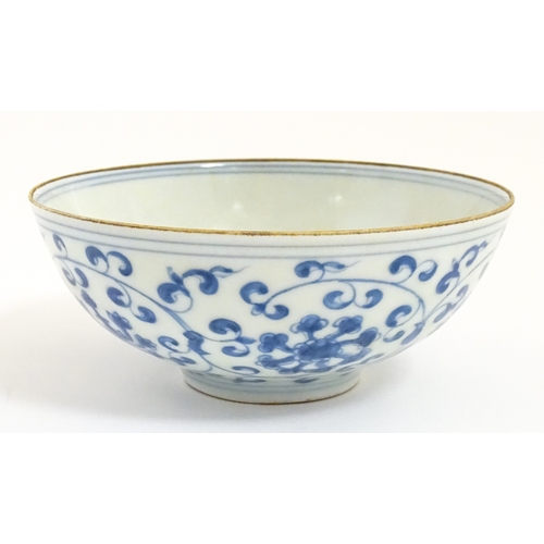 33 - Two small Chinese blue and white bowls with scrolling floral decoration. Both with character marks u... 