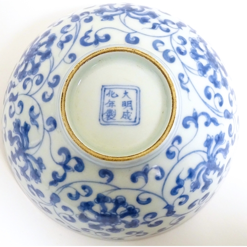 33 - Two small Chinese blue and white bowls with scrolling floral decoration. Both with character marks u... 