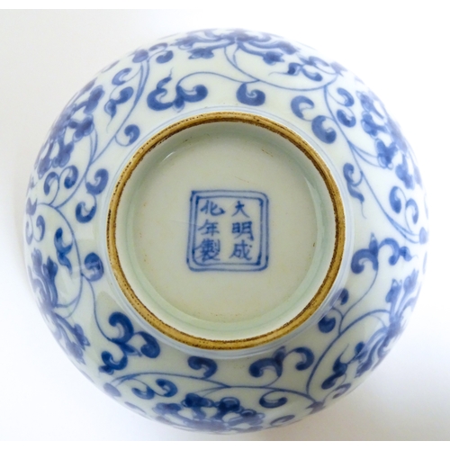 33 - Two small Chinese blue and white bowls with scrolling floral decoration. Both with character marks u... 