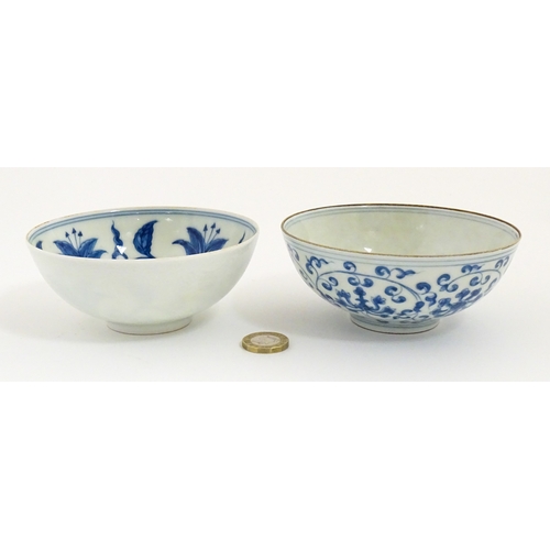 33 - Two small Chinese blue and white bowls with scrolling floral decoration. Both with character marks u... 