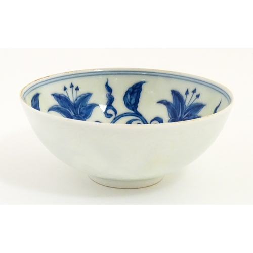 33 - Two small Chinese blue and white bowls with scrolling floral decoration. Both with character marks u... 