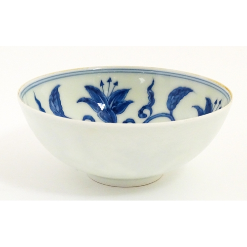33 - Two small Chinese blue and white bowls with scrolling floral decoration. Both with character marks u... 