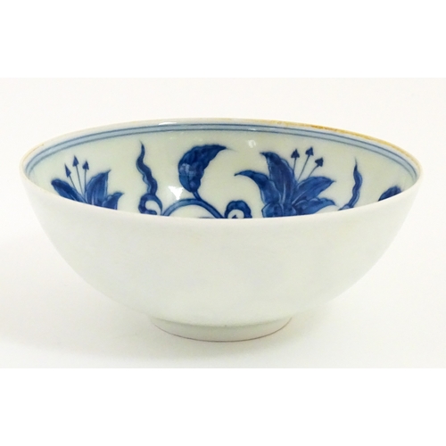 33 - Two small Chinese blue and white bowls with scrolling floral decoration. Both with character marks u... 