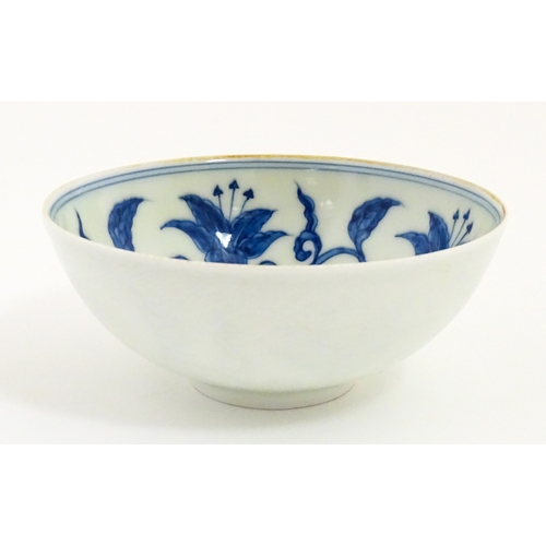 33 - Two small Chinese blue and white bowls with scrolling floral decoration. Both with character marks u... 