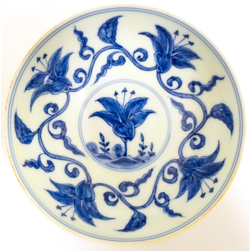 33 - Two small Chinese blue and white bowls with scrolling floral decoration. Both with character marks u... 