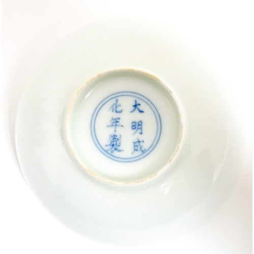33 - Two small Chinese blue and white bowls with scrolling floral decoration. Both with character marks u... 