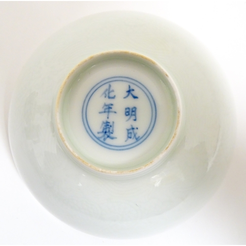 33 - Two small Chinese blue and white bowls with scrolling floral decoration. Both with character marks u... 