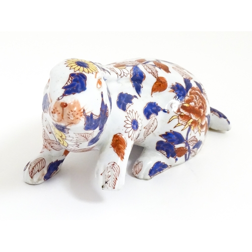 34 - A Chinese export blue and white plate decorated with a river landscape with figures, pagodas, etc. T... 