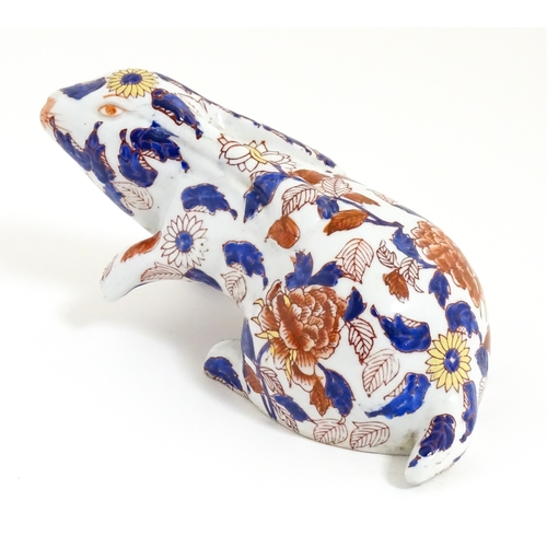 34 - A Chinese export blue and white plate decorated with a river landscape with figures, pagodas, etc. T... 