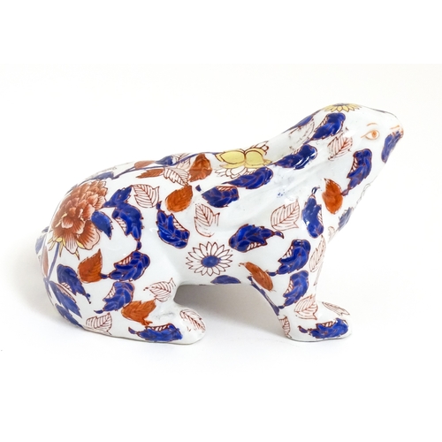 34 - A Chinese export blue and white plate decorated with a river landscape with figures, pagodas, etc. T... 