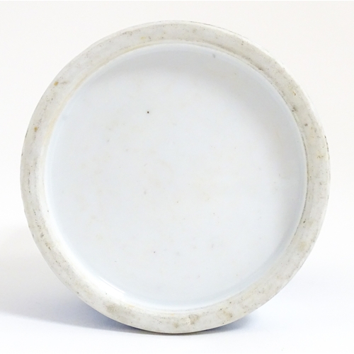 47 - A Chinese blue and white brush pot decorated with figures in a garden landscape. Approx. 4 3/4