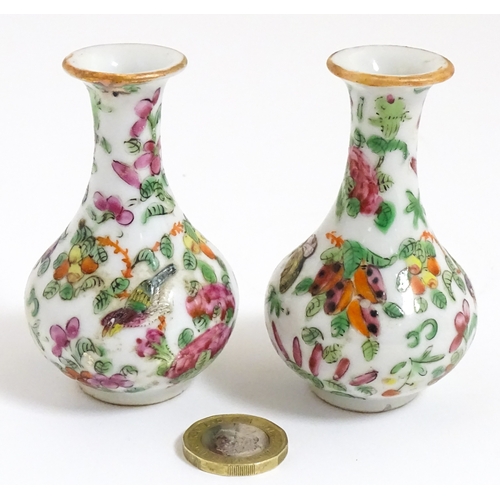 5 - A pair of small Chinese / Cantonese miniature vases decorated with birds, flowers and foliage. Appro... 