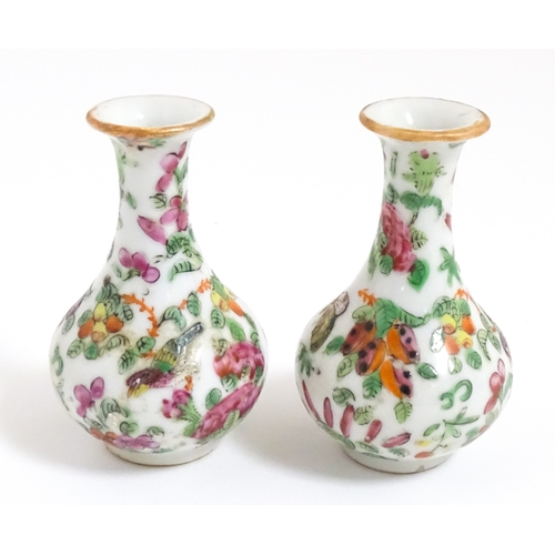5 - A pair of small Chinese / Cantonese miniature vases decorated with birds, flowers and foliage. Appro... 
