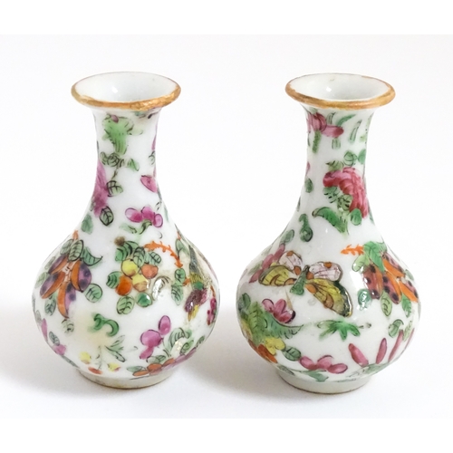 5 - A pair of small Chinese / Cantonese miniature vases decorated with birds, flowers and foliage. Appro... 