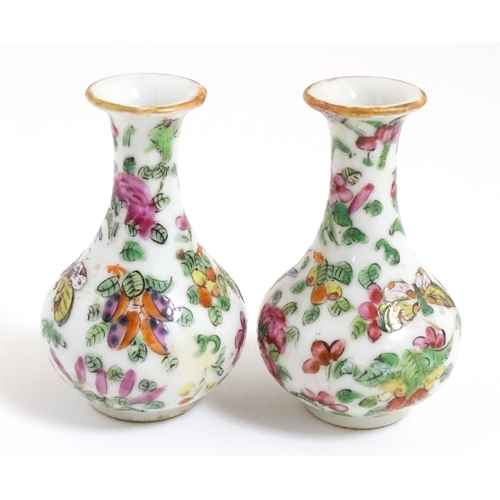 5 - A pair of small Chinese / Cantonese miniature vases decorated with birds, flowers and foliage. Appro... 