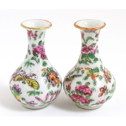 5 - A pair of small Chinese / Cantonese miniature vases decorated with birds, flowers and foliage. Appro... 