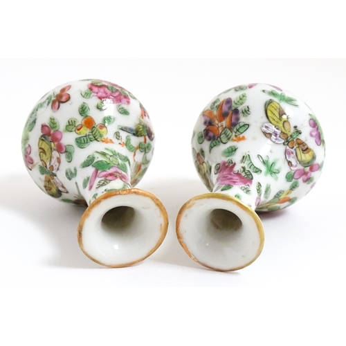 5 - A pair of small Chinese / Cantonese miniature vases decorated with birds, flowers and foliage. Appro... 