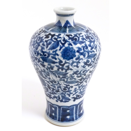 9 - A Chinese blue and white vase with floral and foliate decoration. Character marks under. Approx. 8 1... 