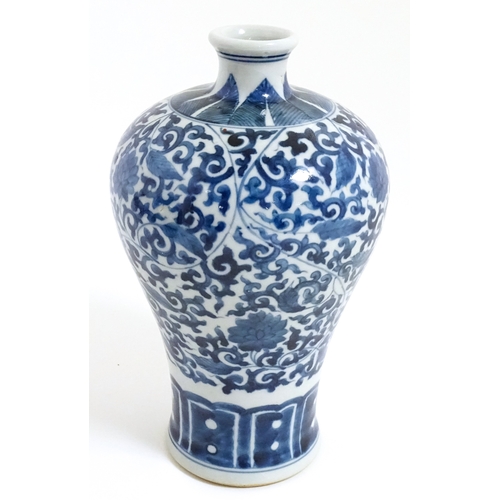 9 - A Chinese blue and white vase with floral and foliate decoration. Character marks under. Approx. 8 1... 