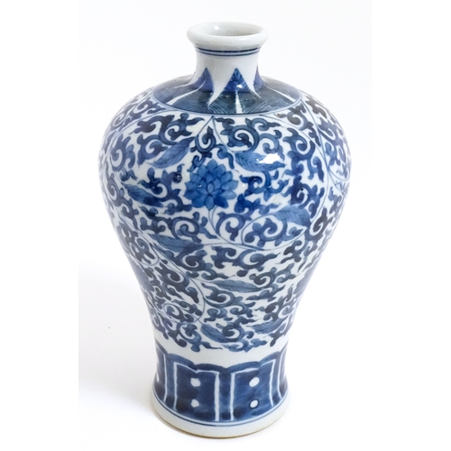 9 - A Chinese blue and white vase with floral and foliate decoration. Character marks under. Approx. 8 1... 
