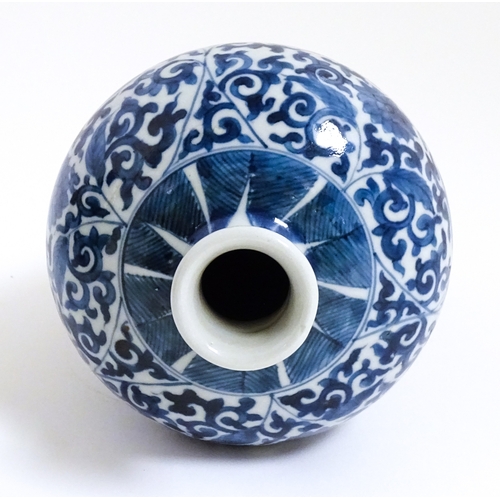 9 - A Chinese blue and white vase with floral and foliate decoration. Character marks under. Approx. 8 1... 