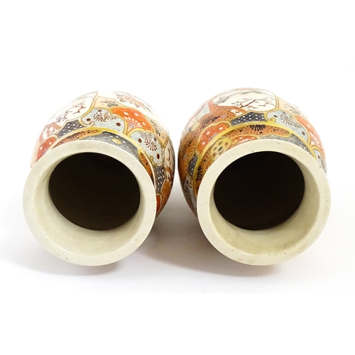 59 - A pair of Japanese Satsuma vases decorated with an Imperial figure and attendants, and a female figu... 