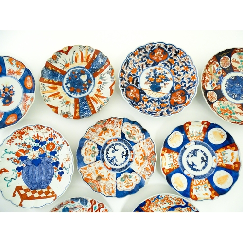 64 - Nine assorted Japanese plates / dishes decorated in the Imari palette with flowers, foliage, etc. La... 