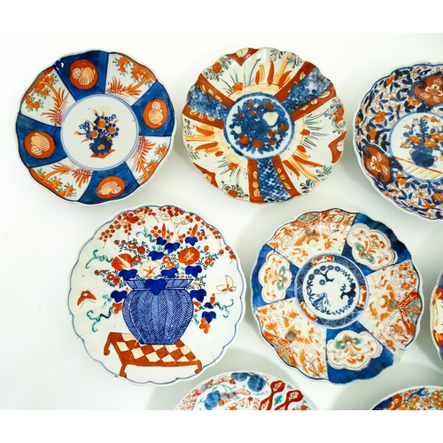 64 - Nine assorted Japanese plates / dishes decorated in the Imari palette with flowers, foliage, etc. La... 