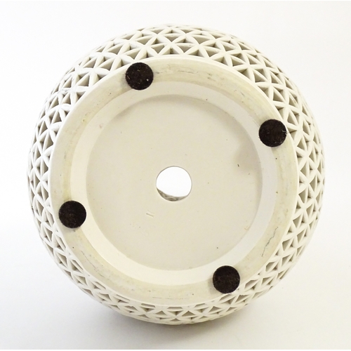 66 - A Chinese vase with reticulated decoration and banded leaf motifs. Approx. 14 3/4