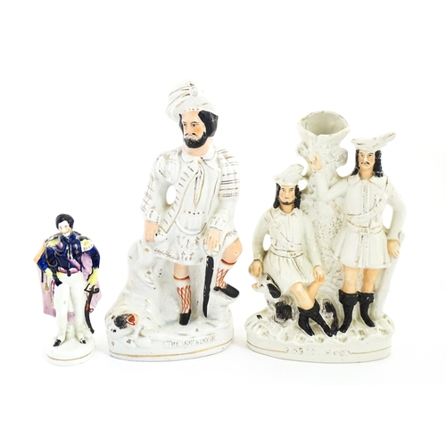 68 - Three Staffordshire pottery figures comprising The Lion Slayer, a spill vase titled Robin Hood, and ... 