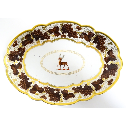 74 - A Barr Flight & Barr dish of oval form with lobed edges decorated with stag armorial to centre, bord... 