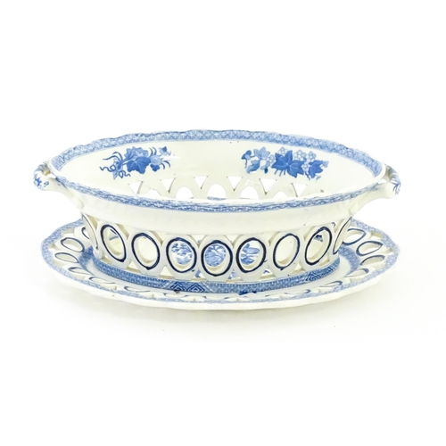 75 - A blue and white chestnut basket and stand with pierced decoration and floral detail. Possibly Spode... 