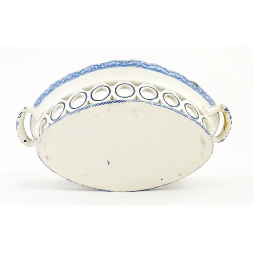 75 - A blue and white chestnut basket and stand with pierced decoration and floral detail. Possibly Spode... 