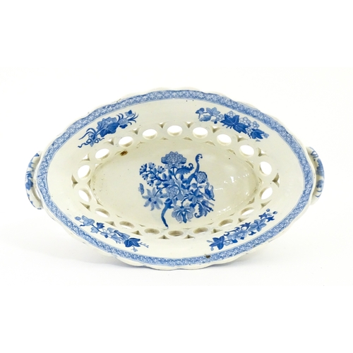 75 - A blue and white chestnut basket and stand with pierced decoration and floral detail. Possibly Spode... 
