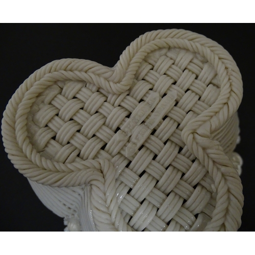 77 - Two Belleek three strand baskets of shamrock form with applied flower and leaf detail to rim. Both w... 