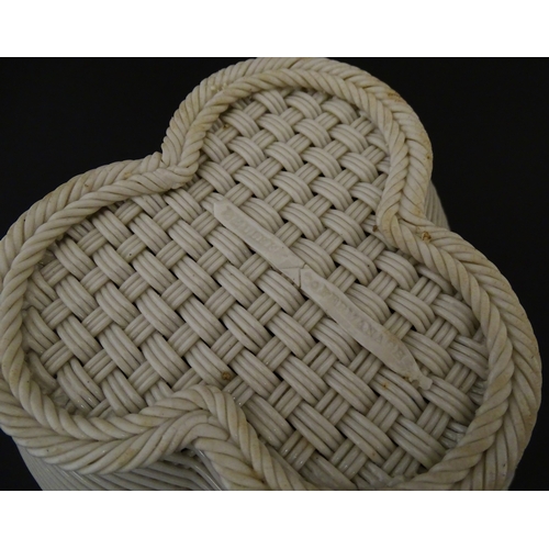 77 - Two Belleek three strand baskets of shamrock form with applied flower and leaf detail to rim. Both w... 