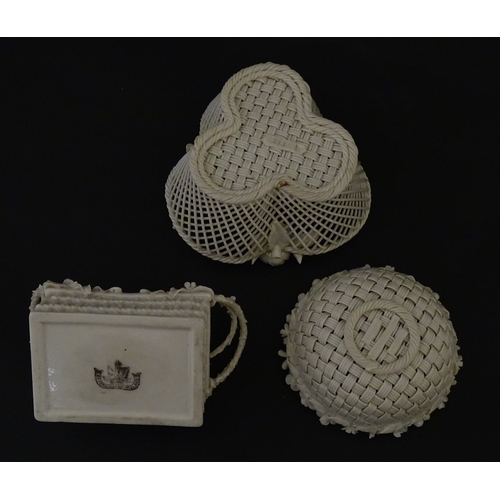 79 - Three Belleek baskets to include a three strand example of shamrock form, a round basket with applie... 