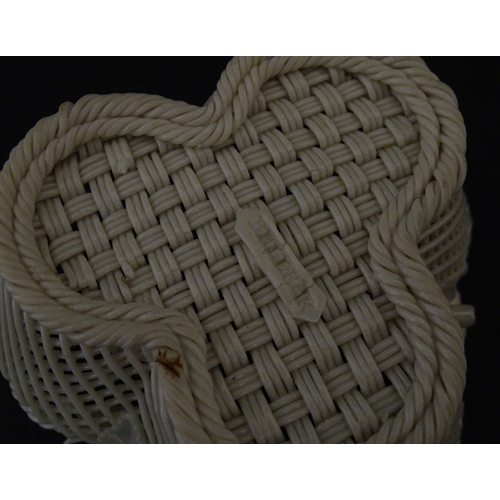 79 - Three Belleek baskets to include a three strand example of shamrock form, a round basket with applie... 