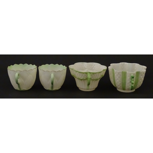 82 - Two Belleek Lily pattern cups and saucers with green highlights. Together with a Belleek 5 O'Clock p... 