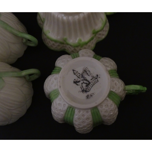 82 - Two Belleek Lily pattern cups and saucers with green highlights. Together with a Belleek 5 O'Clock p... 