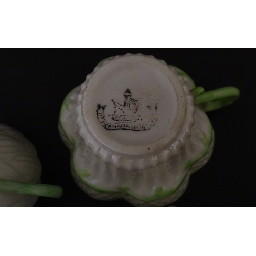 82 - Two Belleek Lily pattern cups and saucers with green highlights. Together with a Belleek 5 O'Clock p... 
