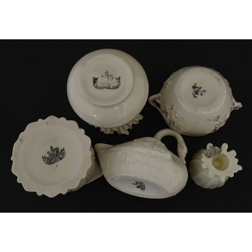 83 - Six assorted Belleek items comprising a cream jug in the Ampanida pattern, a small vase with bow det... 